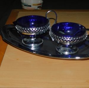 Cute vintage cobalt blue glass sugar and creamer dishes.
